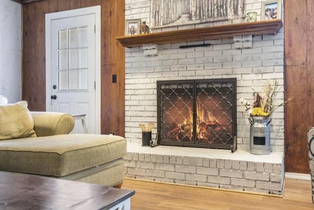 room details featuring a fireplace and wood finished floors