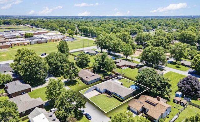 birds eye view of property featuring a residential view and a forest view