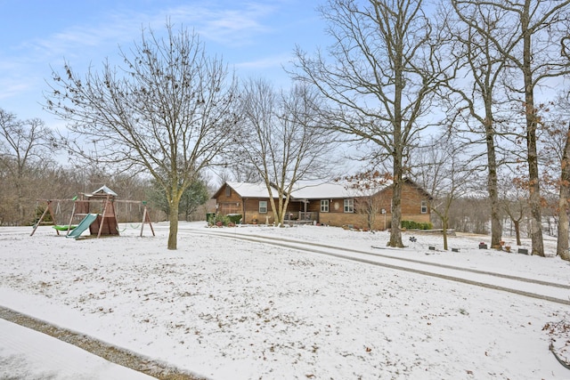 yard covered in snow featuring playground community