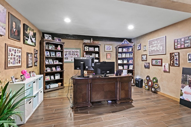 office area featuring recessed lighting, wood tiled floor, and a textured wall