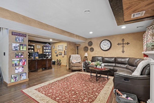 living room with baseboards, visible vents, dark wood-type flooring, and recessed lighting