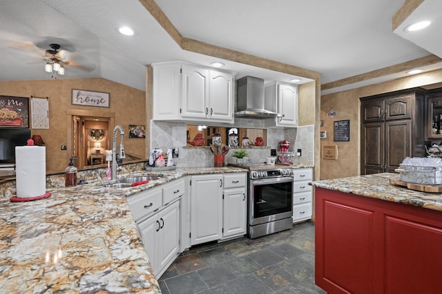 kitchen with white cabinets, a sink, wall chimney range hood, and stainless steel electric stove