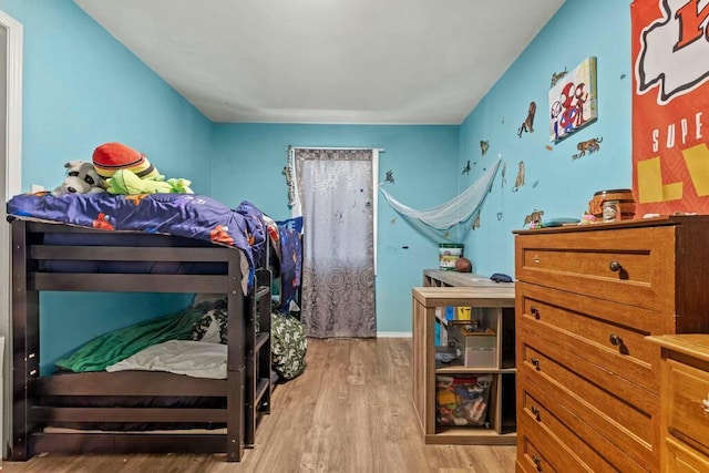 bedroom with light wood finished floors