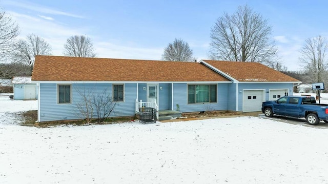 ranch-style house featuring a garage