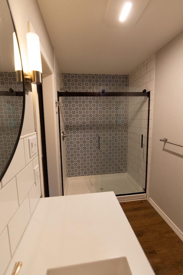 912 Armstrong Ave, West Plains, MO 65775 - bathroom featuring baseboards, wood finished floors, and a shower stall