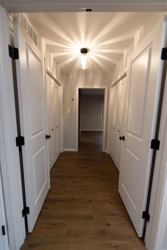 912 Armstrong Ave, West Plains, MO 65775 - hall with visible vents and dark wood-style flooring