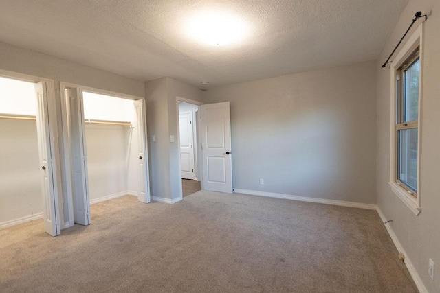 912 Armstrong Ave, West Plains, MO 65775 - unfurnished bedroom featuring baseboards, carpet flooring, and a textured ceiling