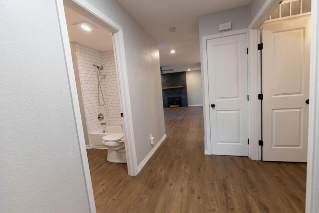 912 Armstrong Ave, West Plains, MO 65775 - corridor with visible vents, baseboards, wood finished floors, and recessed lighting