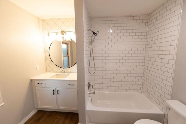 912 Armstrong Ave, West Plains, MO 65775 - bathroom featuring tub / shower combination, wood finished floors, toilet, and vanity