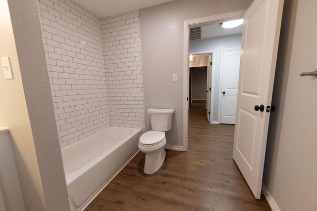912 Armstrong Ave, West Plains, MO 65775 - full bath with shower / bath combination, toilet, wood finished floors, and visible vents