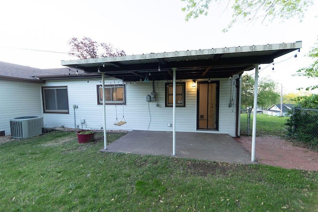 912 Armstrong Ave, West Plains, MO 65775 - rear view of house with cooling unit, a yard, and a patio area