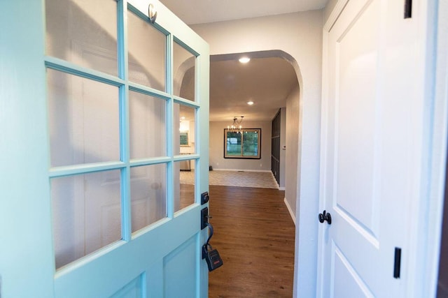 912 Armstrong Ave, West Plains, MO 65775 - hallway featuring recessed lighting, an inviting chandelier, arched walkways, baseboards, and dark wood-style flooring