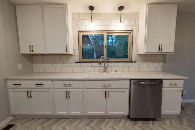 912 Armstrong Ave, West Plains, MO 65775 - kitchen with light countertops, dishwasher, a sink, baseboards, and tasteful backsplash
