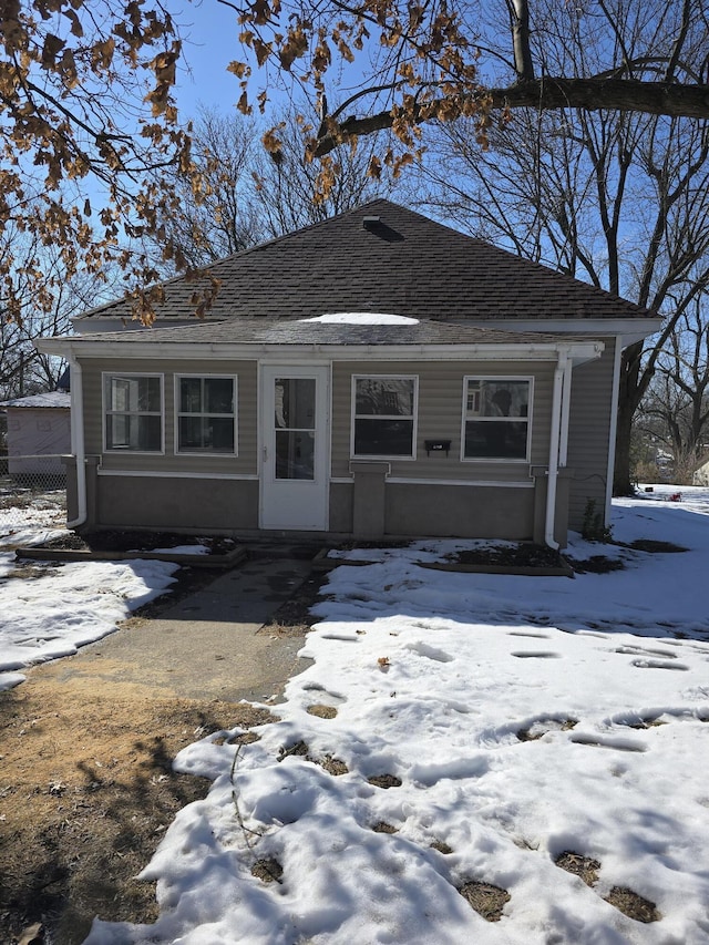 view of front of house featuring roof with shingles