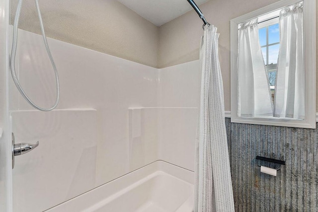 bathroom featuring shower / bath combination with curtain