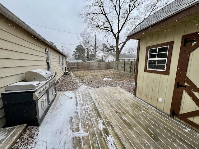 deck featuring a fenced backyard and a grill