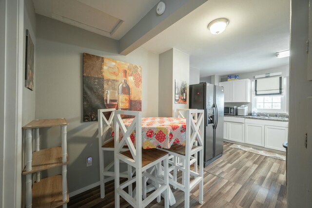 dining space featuring light wood-type flooring