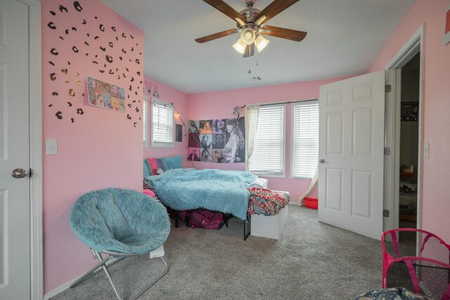 carpeted bedroom featuring a ceiling fan