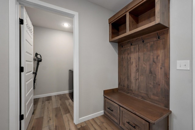 mudroom with light wood-style flooring and baseboards