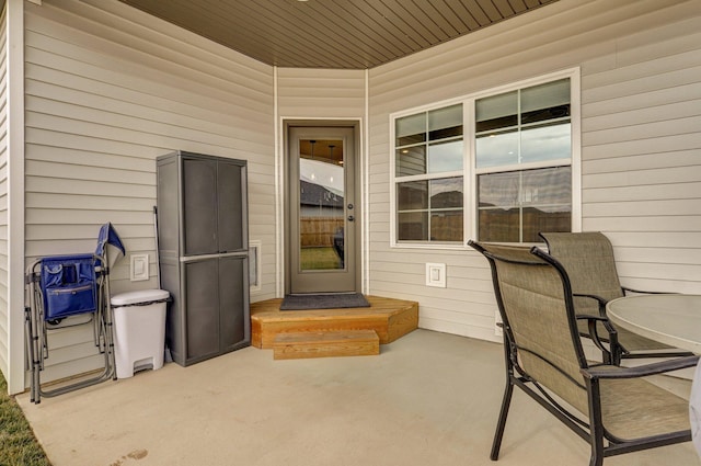 entrance to property featuring a patio