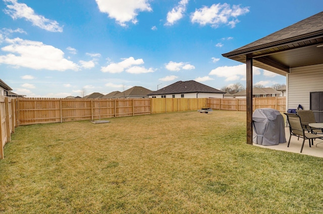 view of yard featuring a patio and a fenced backyard