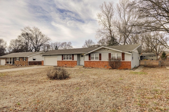 ranch-style house with brick siding, an attached garage, crawl space, fence, and driveway