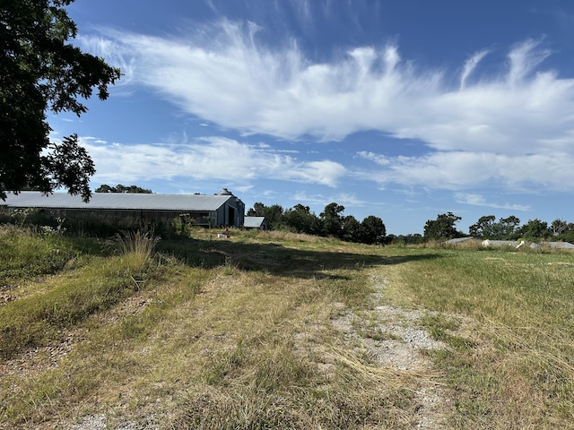 view of yard with a rural view