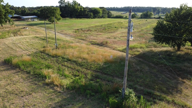 view of yard with a rural view