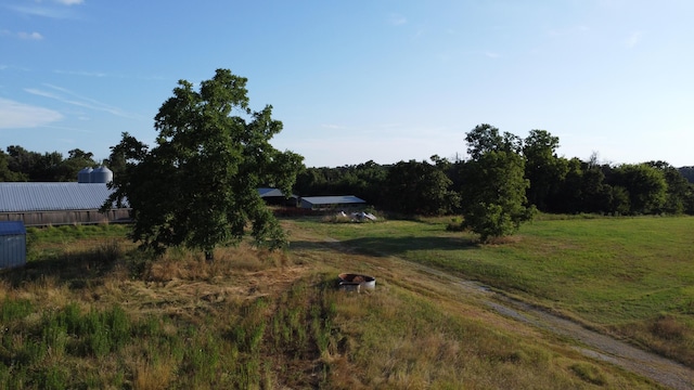 view of yard with a rural view