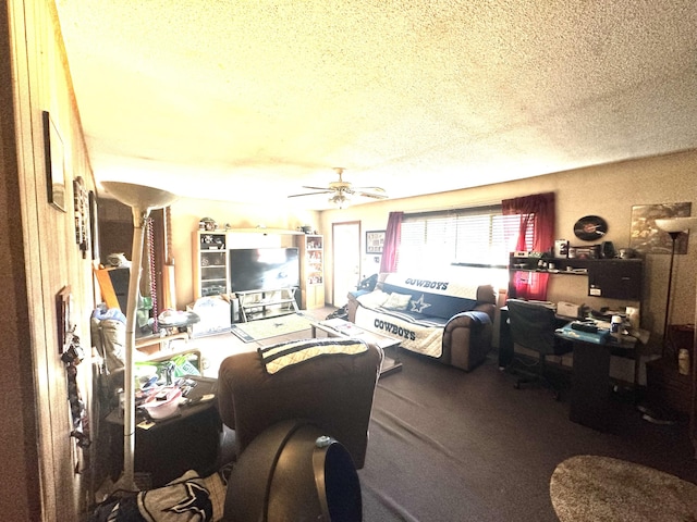 living room with ceiling fan and a textured ceiling