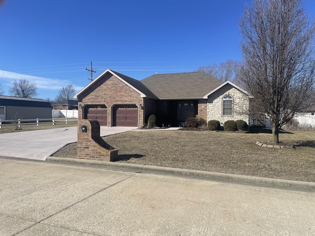 ranch-style house with a shingled roof, an attached garage, fence, stone siding, and driveway