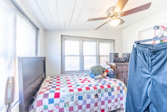 bedroom with wood ceiling, vaulted ceiling, and ceiling fan