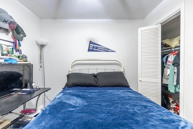 bedroom featuring a walk in closet and a closet