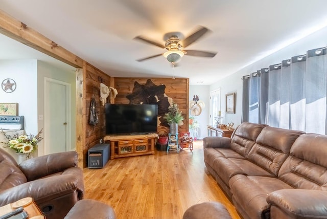 living room featuring light wood finished floors and a ceiling fan