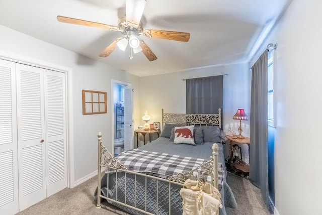 bedroom with ceiling fan, carpet floors, a closet, and baseboards