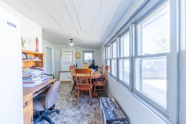 dining space with vaulted ceiling and wood ceiling