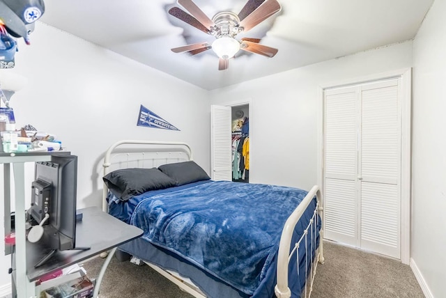 carpeted bedroom featuring a ceiling fan and baseboards