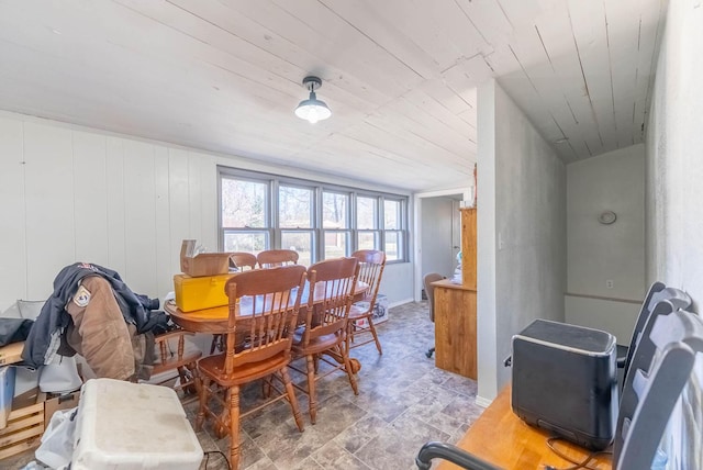 dining space with wood ceiling