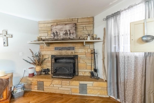 room details featuring visible vents and wood finished floors