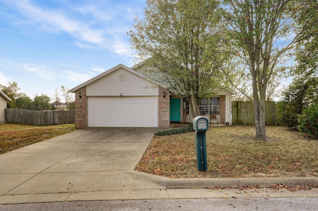 ranch-style home featuring a garage, driveway, brick siding, and fence