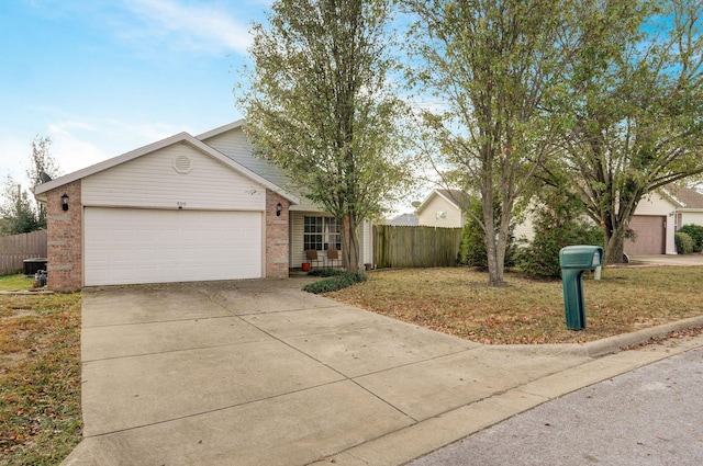 ranch-style house with a garage, concrete driveway, brick siding, and fence