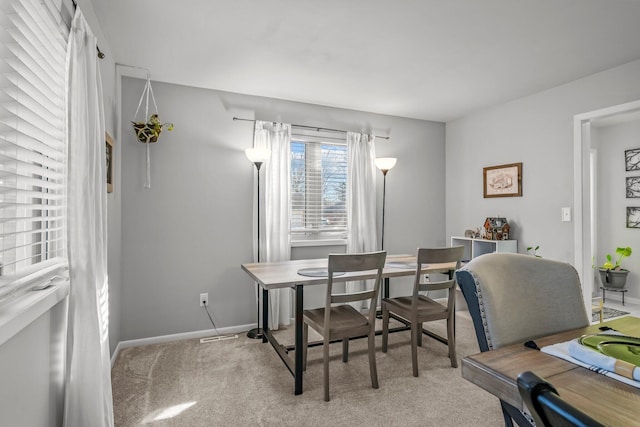 office featuring light carpet and baseboards