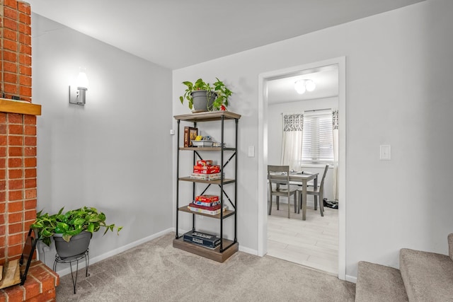 interior space with carpet floors, stairs, and baseboards