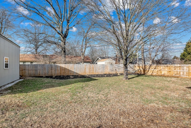 view of yard with a fenced backyard