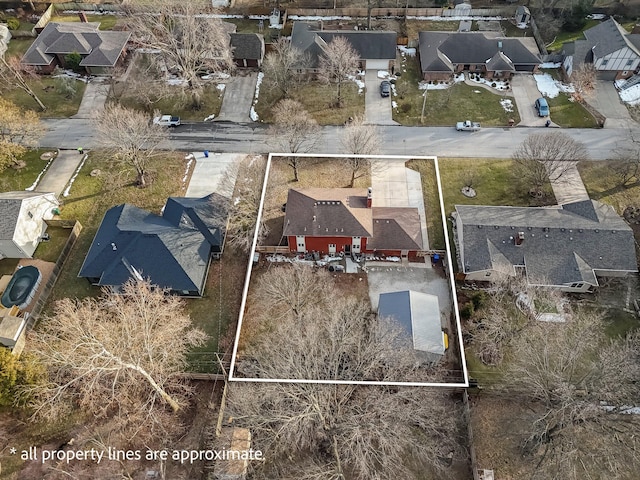 birds eye view of property with a residential view