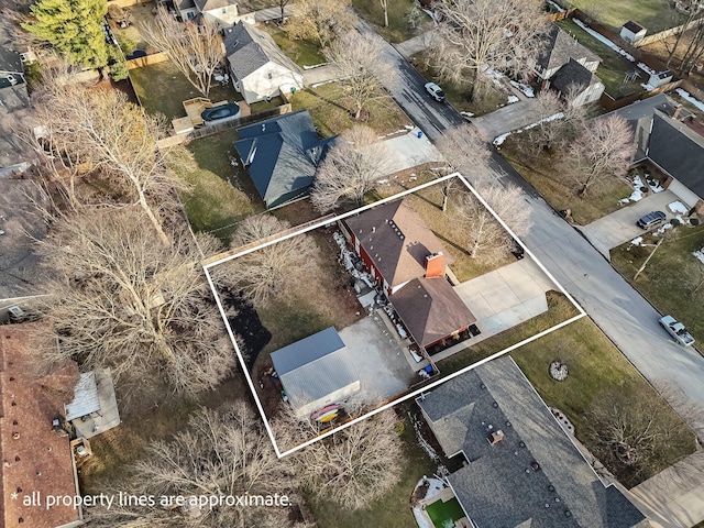 birds eye view of property with a residential view