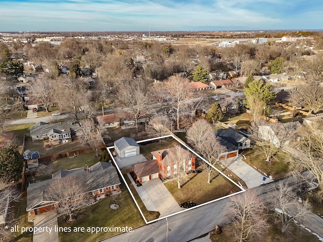 birds eye view of property with a residential view