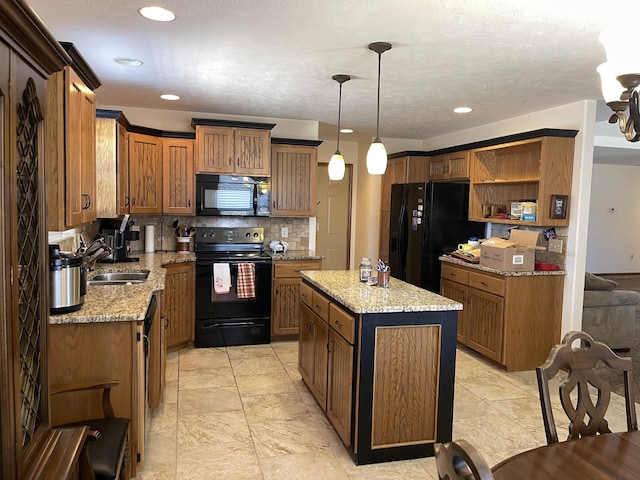 kitchen with tasteful backsplash, decorative light fixtures, a center island, black appliances, and a sink