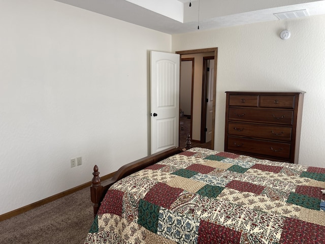 carpeted bedroom featuring visible vents and baseboards