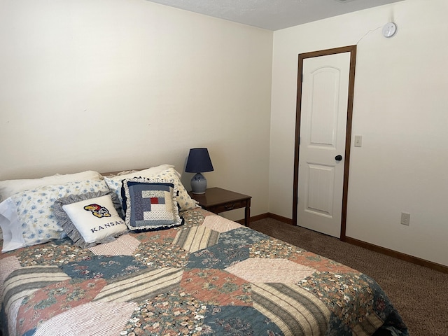 carpeted bedroom with baseboards